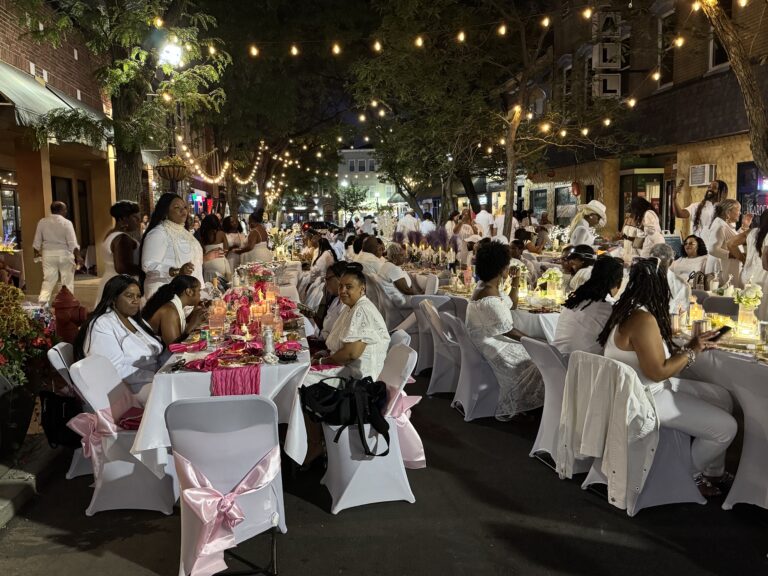 White-decorated tables under string lights line Cherry Street in Rahway.