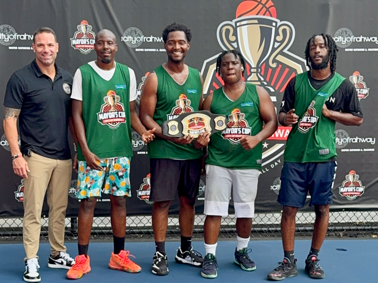 Rahway Mayor Giacobbe poses with Team Jordan, the 18+ division winners at the Mayor’s Cup basketball tournament.