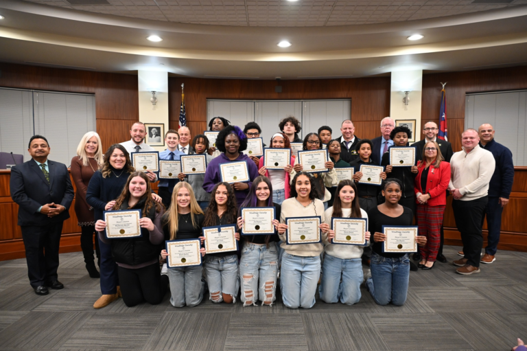 Woodbridge Township honors Avenel Middle School basketball teams and Crimson Knights youth cross country athletes at council meeting.
